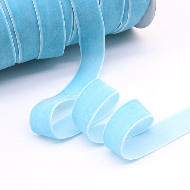 Light blue Household Portable Solid Color Velvet Ribbon roll, soft texture ideal for baby showers, crafts, and seasonal decorations.