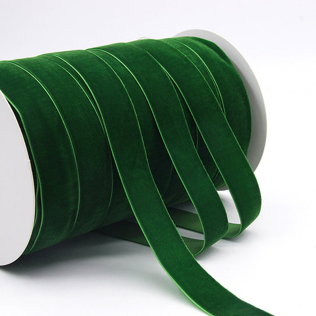 Green Household Portable Solid Color Velvet Ribbon spool, rich color ideal for Christmas crafts, wreaths, and gift wrapping.