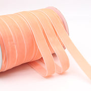 Peach-colored Household Portable Solid Color Velvet Ribbon roll, ideal for spring crafts, baby showers, and elegant packaging.