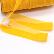 Bright yellow Household Portable Solid Color Velvet Ribbon roll, perfect for DIY crafts, festive decorations, and elegant gift wrapping.