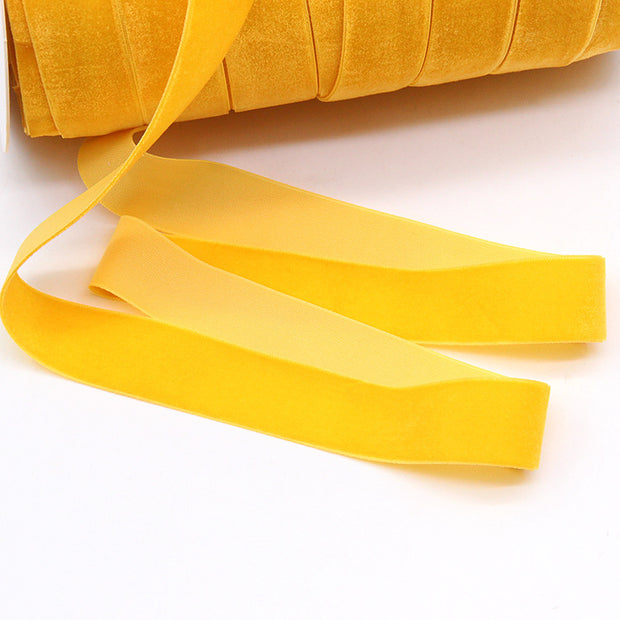 Bright yellow Household Portable Solid Color Velvet Ribbon roll, perfect for DIY crafts, festive decorations, and elegant gift wrapping.
