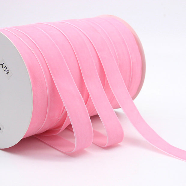 Pink Household Portable Solid Color Velvet Ribbon spool, perfect for romantic crafts, gift wrapping, and party decorations.
